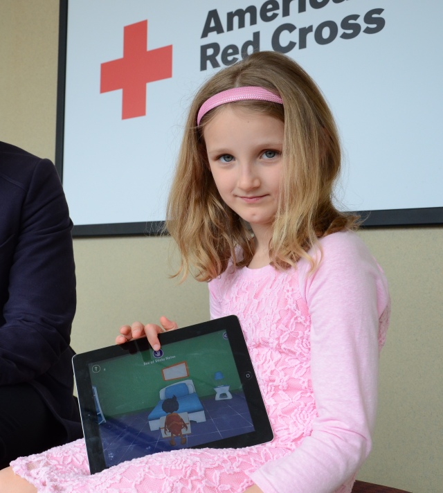 In two days, Aryn Gill, 7, graduated from rookie to member playing the American Red Cross Monster Guard mobile app that prepares kids for real-life emergencies. Photo credit: Lynette Nyman/American Red Cross