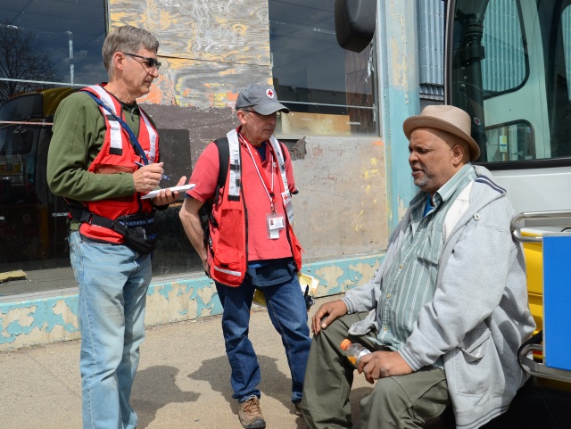 W. Broadway Fire victim Cliff Garrett shares his story with Red Cross volunteers in North Minneapolis on April 15, 2015. Photo credit: Lynette Nyman/American Red Cross