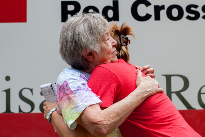 “I want a hug,” said Fonda Buckley, a resident just beginning to recover from the historic flooding in southern Louisiana, who stopped to talk with Red Cross relief worker Lynette Nyman in Denham Springs, Louisiana, August 18, 2016. Photo credit: Marko Kokic/American Red Cross